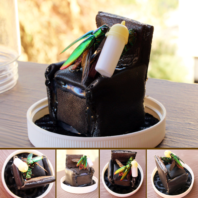 Two metallic beetles in family moment with ribbon-made diaper and bottle feeding on a recliner